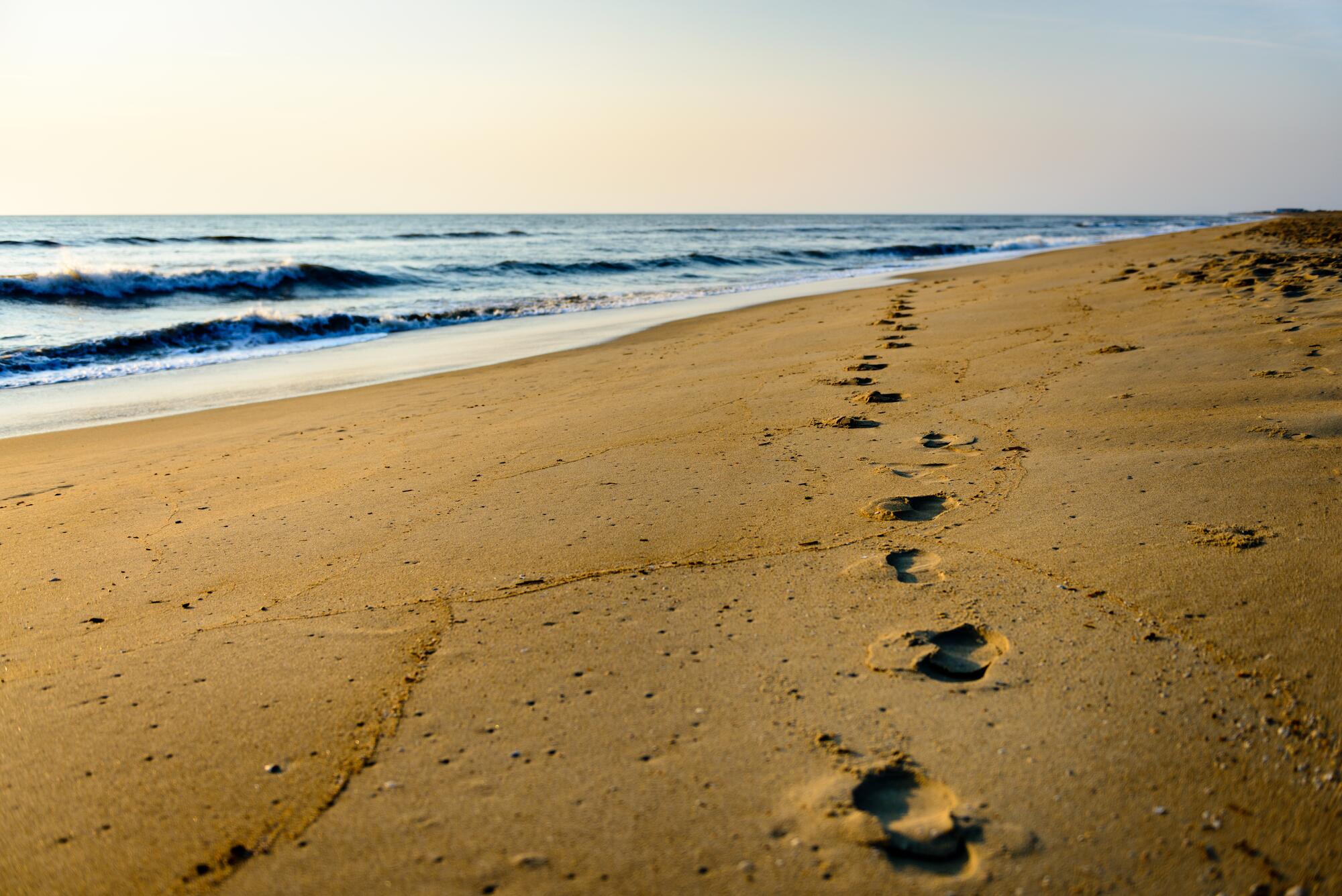 empty beach with foot prints
