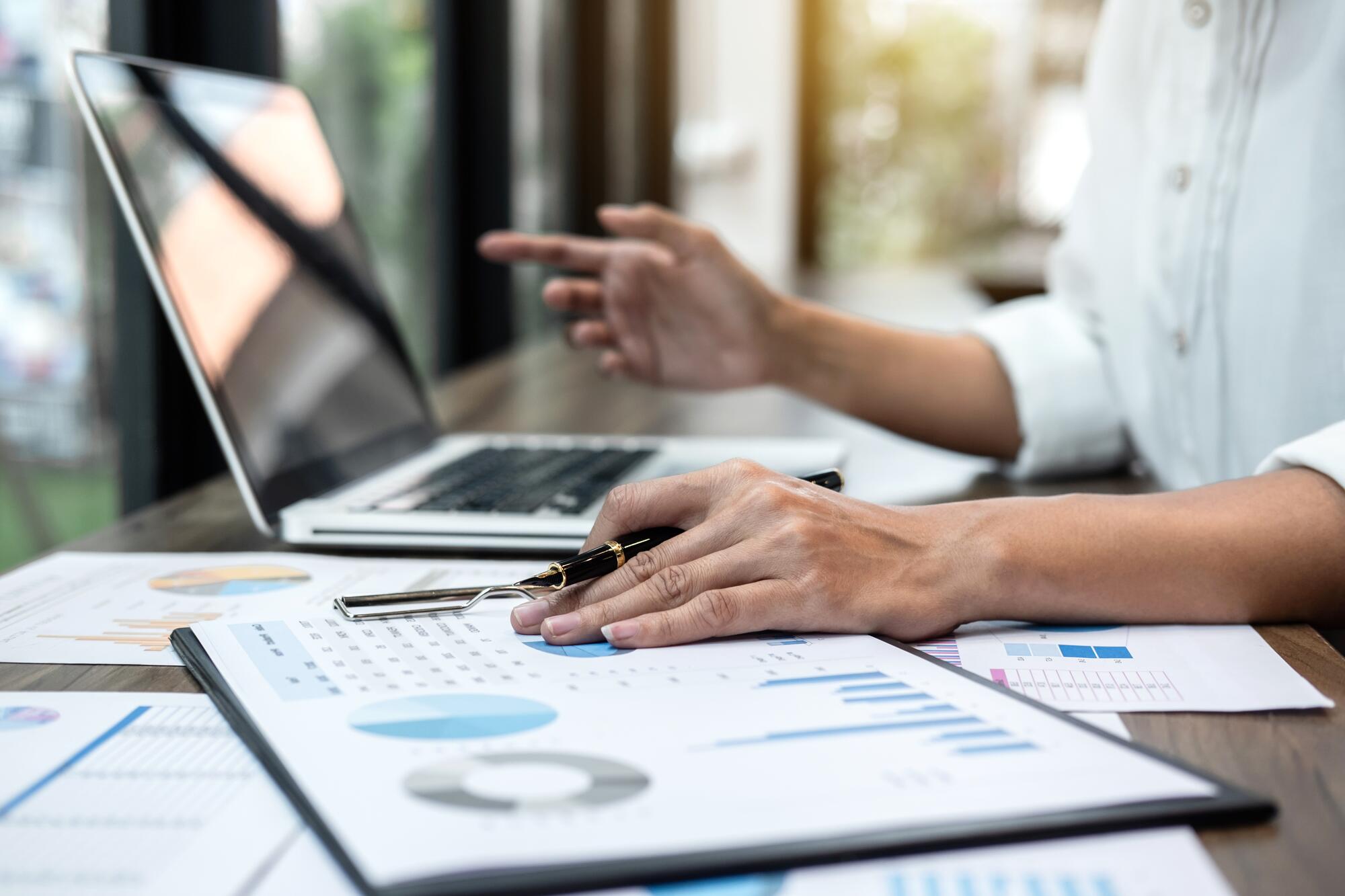 close-up-hands-financial-data