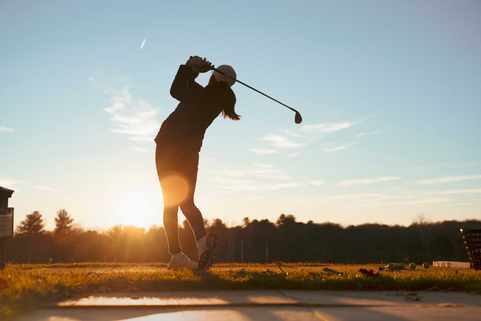 person golfing